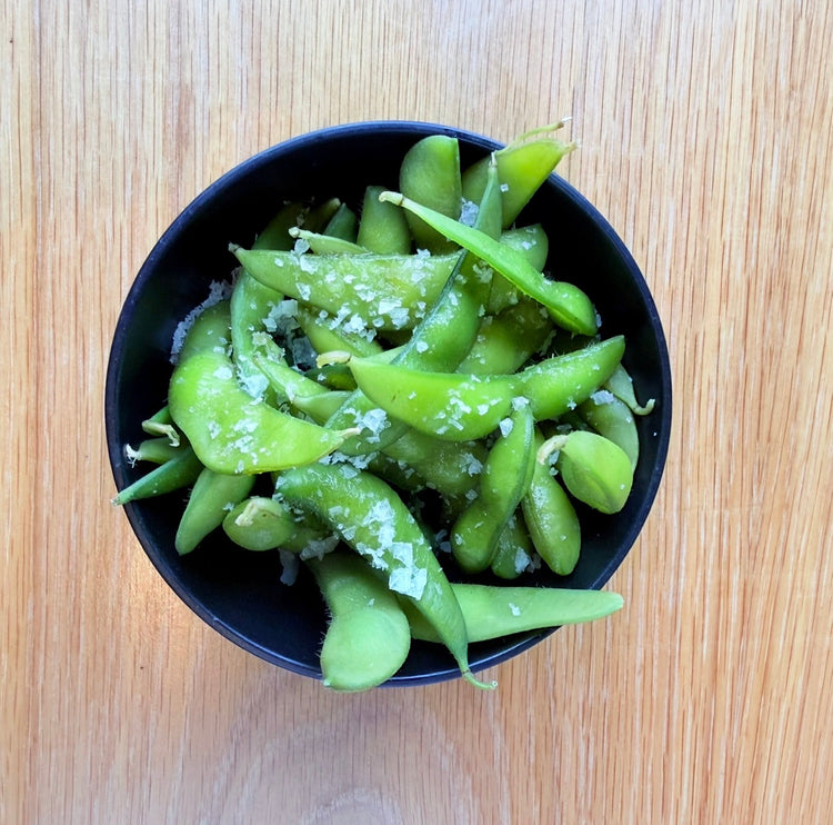 A bowl of salted edamame
